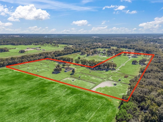 birds eye view of property with a rural view