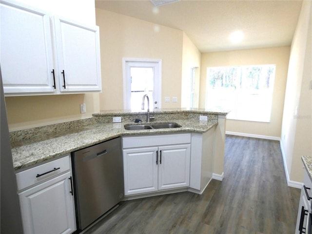 kitchen with white cabinetry, sink, stainless steel dishwasher, light stone counters, and kitchen peninsula