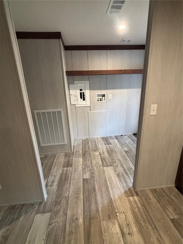 laundry area featuring hookup for a washing machine and hardwood / wood-style flooring