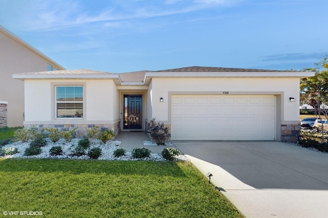 view of front of property with a garage and a front lawn