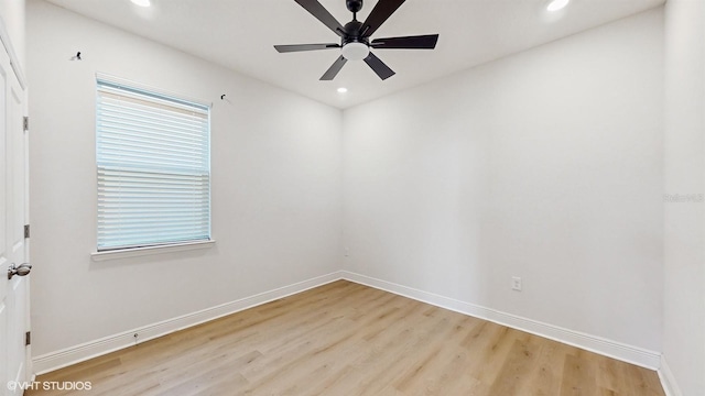 empty room featuring ceiling fan, a healthy amount of sunlight, and light hardwood / wood-style floors