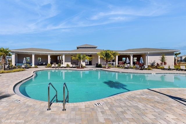 view of swimming pool with a patio