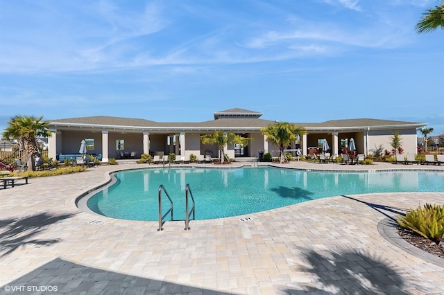 view of swimming pool with a patio area