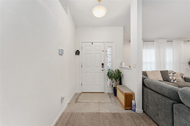 foyer featuring light tile patterned floors