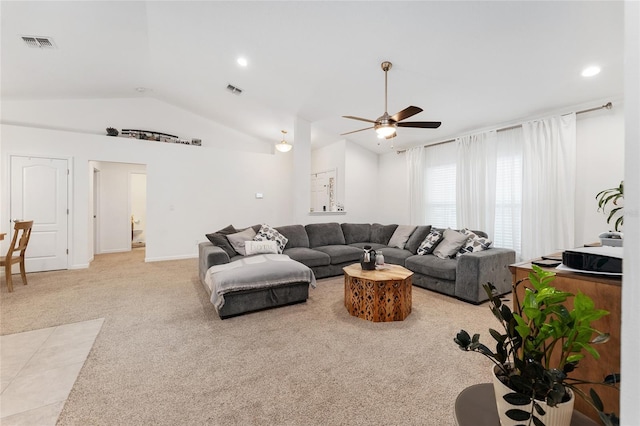 living room with ceiling fan, light carpet, and vaulted ceiling