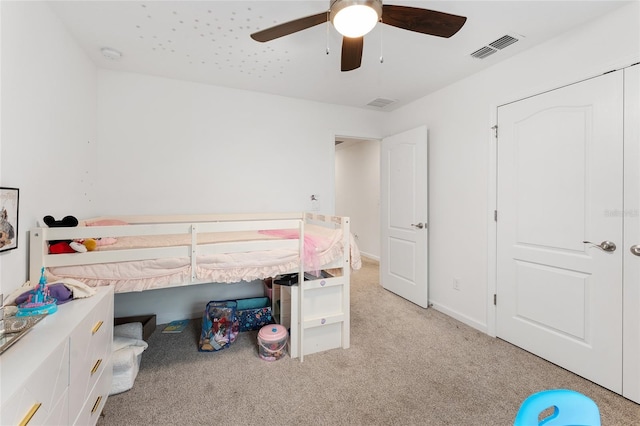 bedroom with light carpet and ceiling fan