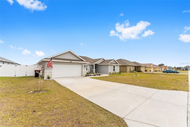 ranch-style home with a front yard and a garage