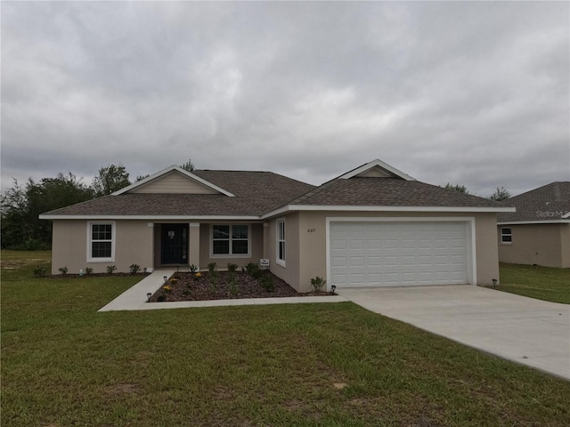 ranch-style home featuring a garage and a front lawn