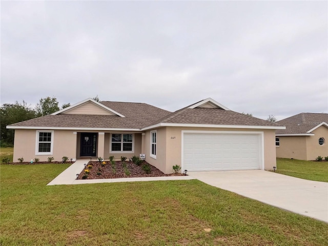 single story home with a garage and a front lawn