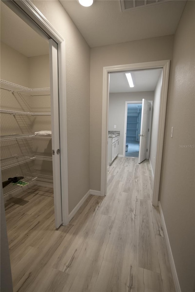 hall featuring light hardwood / wood-style flooring