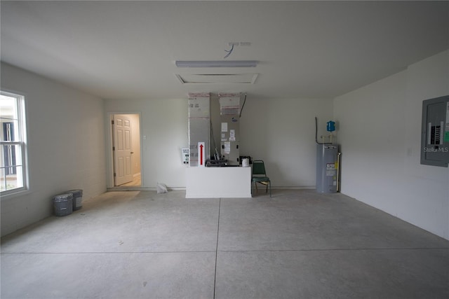 garage featuring electric panel, heating unit, and water heater