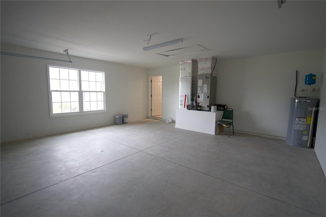 garage with electric water heater and heating unit