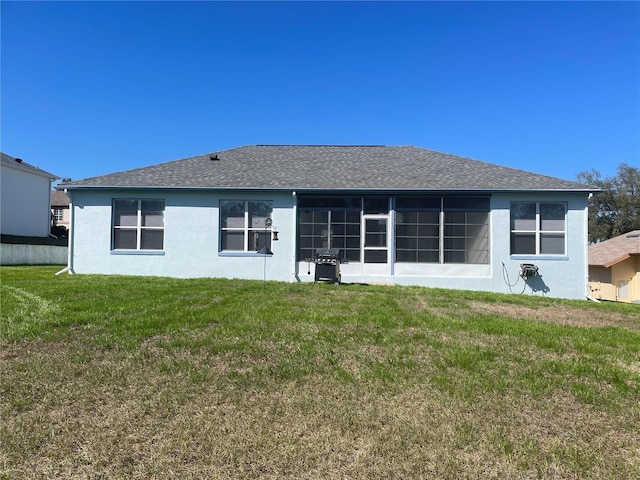 back of house with a yard