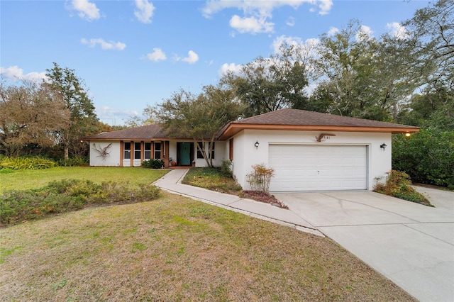 ranch-style house with a garage and a front yard