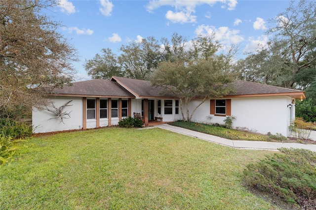 ranch-style home with a front yard