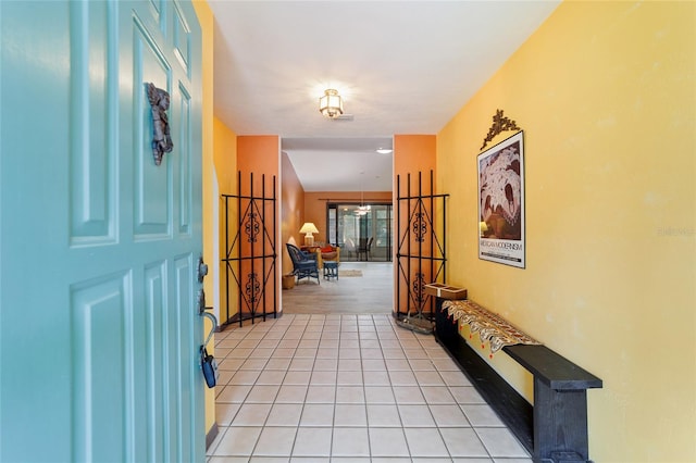 entryway with light tile patterned flooring