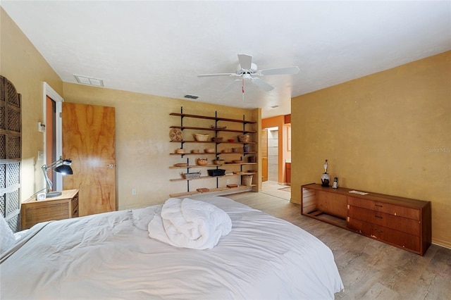 bedroom featuring light hardwood / wood-style floors and ceiling fan