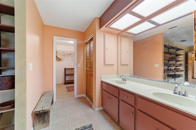 bathroom with vanity and tile patterned flooring