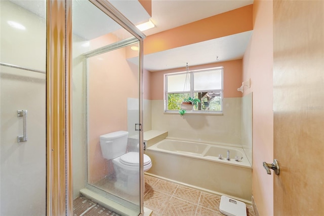 bathroom with toilet and shower with separate bathtub