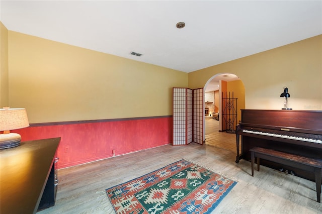 miscellaneous room with wood-type flooring