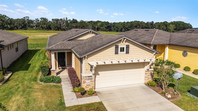 view of front of property with a garage and a front yard