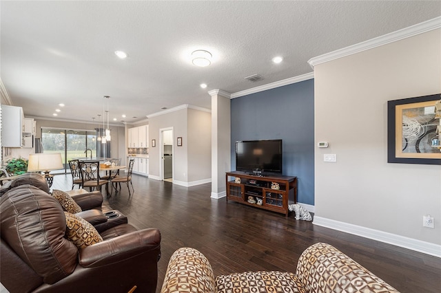 living room featuring dark wood-type flooring, crown molding, and a textured ceiling