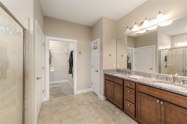 bathroom featuring vanity and a shower with door