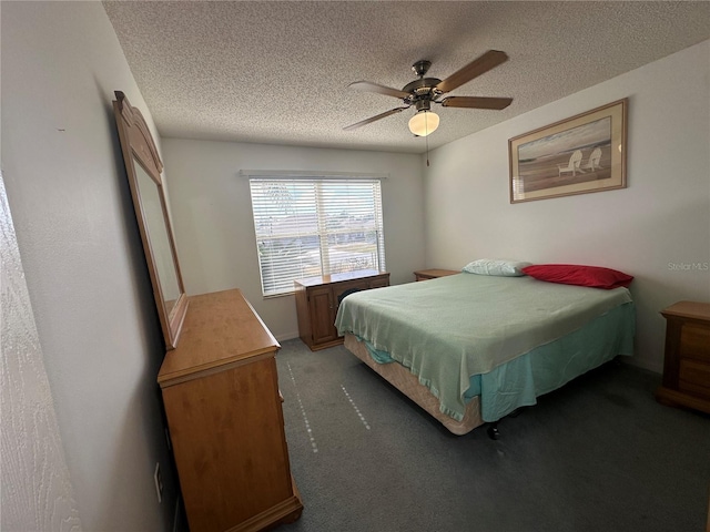 carpeted bedroom with ceiling fan and a textured ceiling