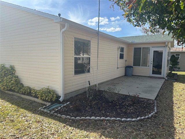 rear view of property featuring a patio