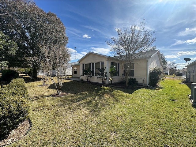 back of house with a yard