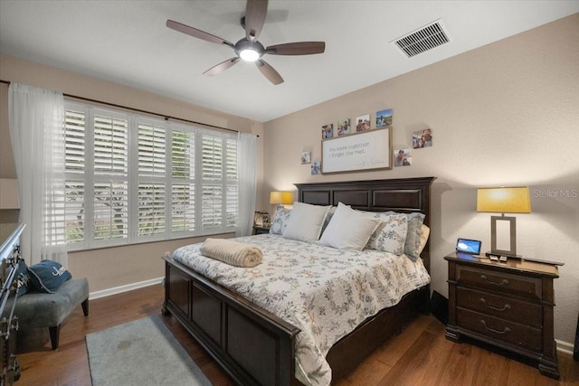 bedroom featuring ceiling fan and dark hardwood / wood-style flooring