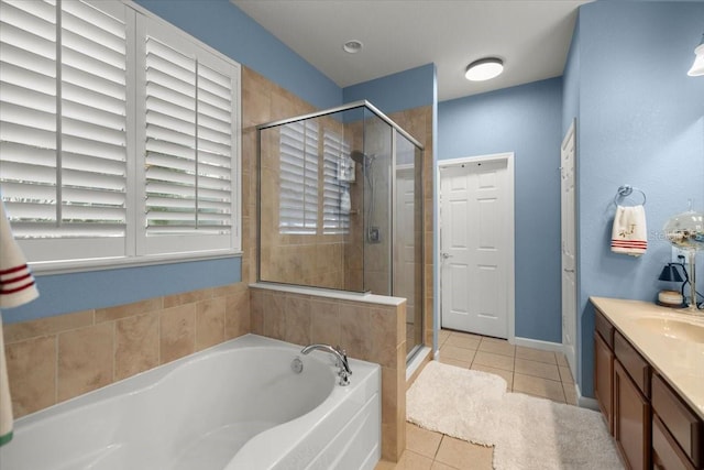 bathroom featuring tile patterned floors, vanity, and independent shower and bath