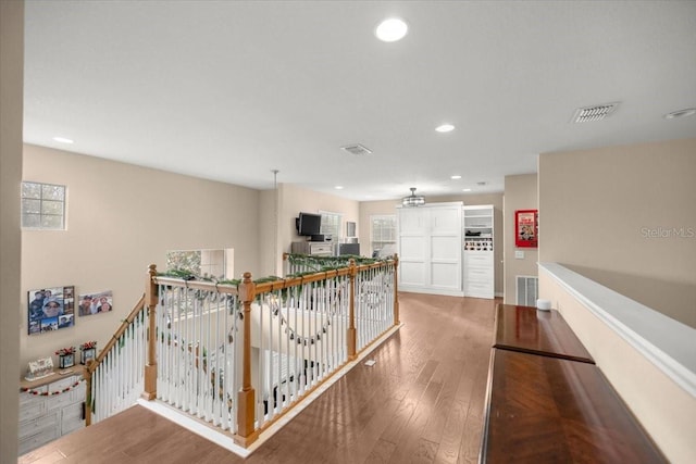 corridor featuring hardwood / wood-style floors