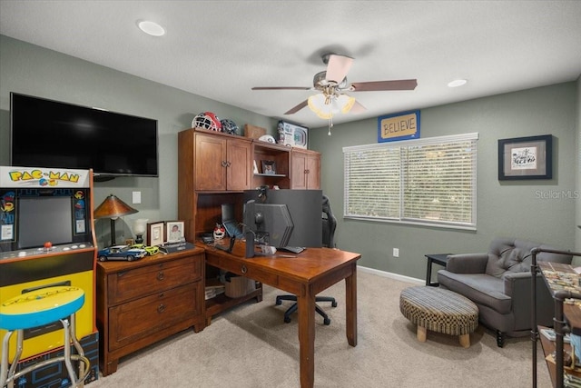 home office with ceiling fan and light colored carpet