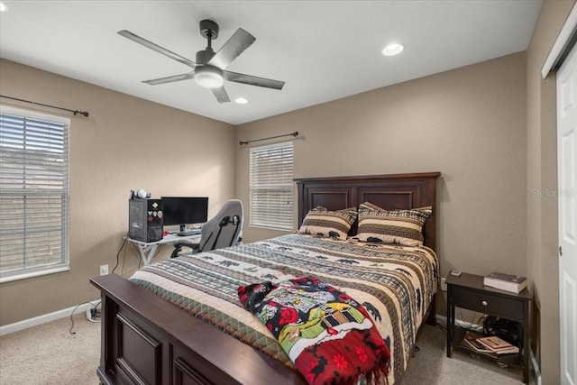 bedroom featuring ceiling fan and light carpet