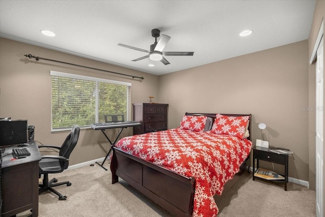 bedroom with ceiling fan and light colored carpet