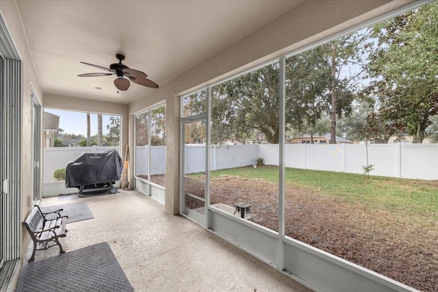 sunroom / solarium with ceiling fan