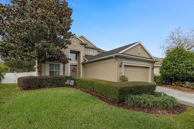 view of front of property featuring a garage and a front yard