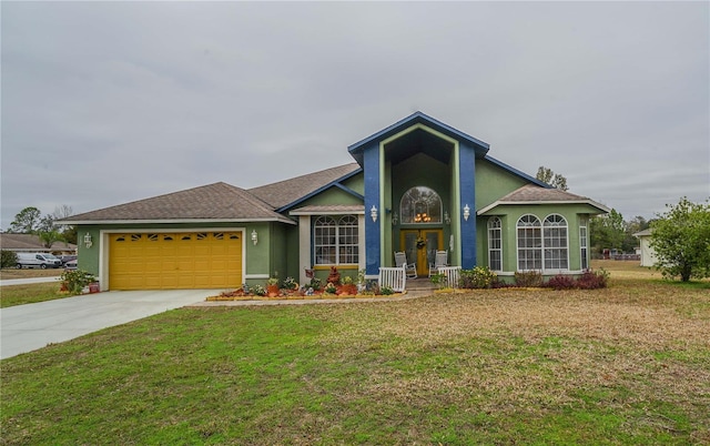 view of front of property with a garage and a front yard