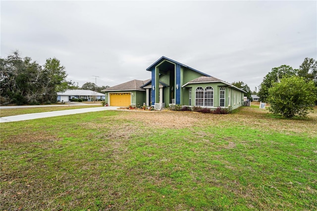 single story home featuring a garage and a front yard