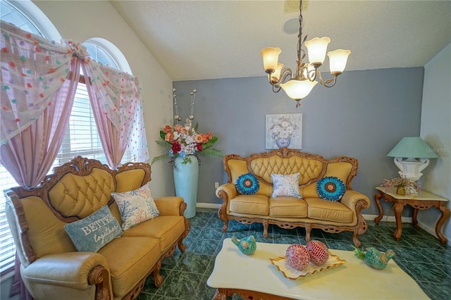 sitting room with a textured ceiling, a chandelier, lofted ceiling, and dark tile patterned floors