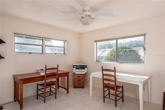 office area featuring ceiling fan and a textured ceiling