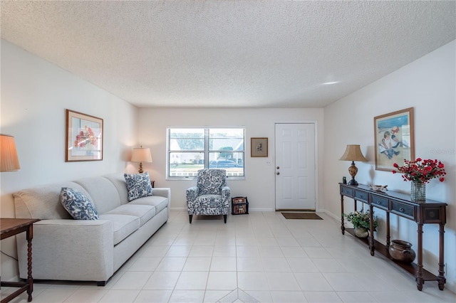 living room with light tile patterned floors and a textured ceiling