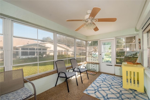 sunroom / solarium featuring ceiling fan and plenty of natural light