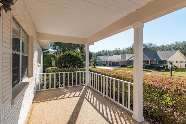 balcony featuring a porch and a residential view