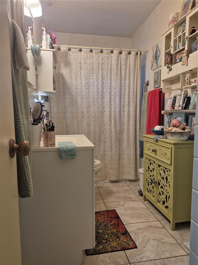 bathroom featuring toilet and walk in shower