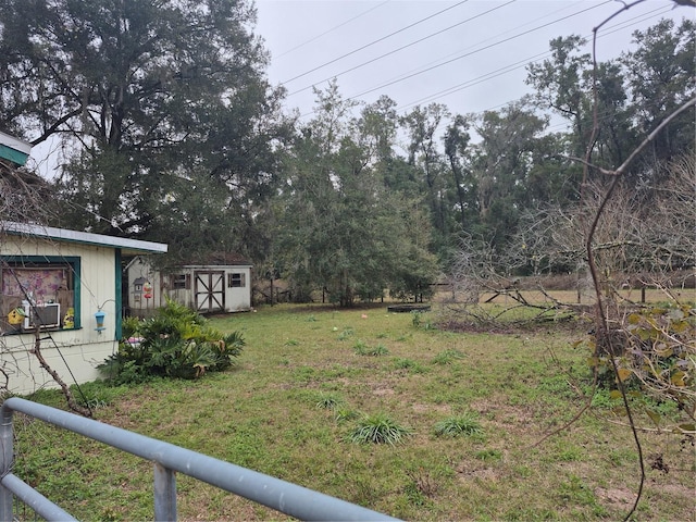 view of yard with cooling unit and a storage shed