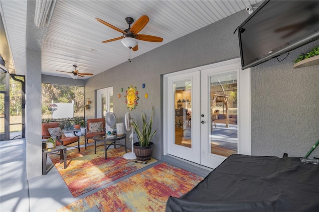 view of patio / terrace featuring ceiling fan and french doors