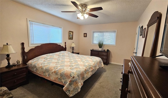 bedroom featuring carpet floors, a textured ceiling, and ceiling fan