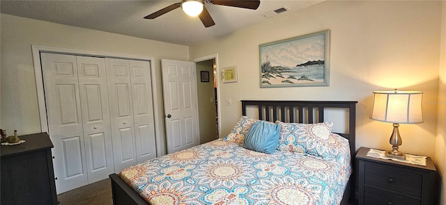 bedroom featuring ceiling fan, a closet, and a textured ceiling